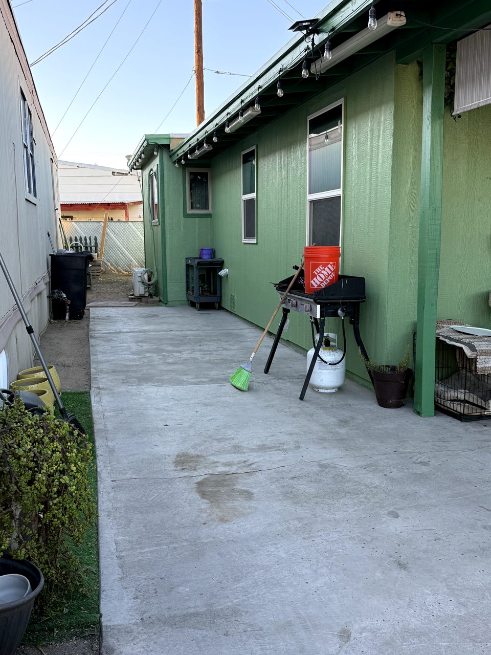 Finished carport with a green-painted ceiling, deep green beams and posts in Phoenix