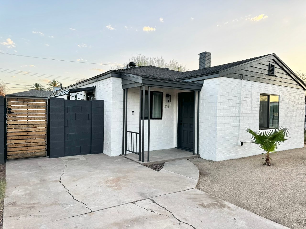 Exterior repaint: white brick & black trim